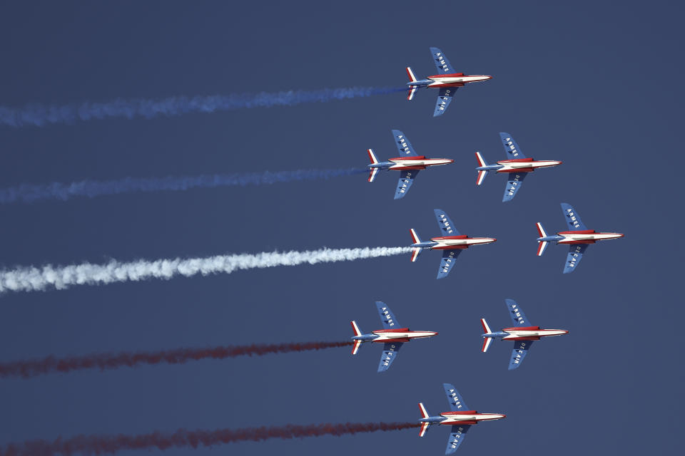 French air force's aerobatics squad "Patrouille de France" (PAF) perform ahead of an alpine ski, women's World Championships super G, in Meribel, France, Wednesday, Feb. 8, 2023. (AP Photo/Gabriele Facciotti)