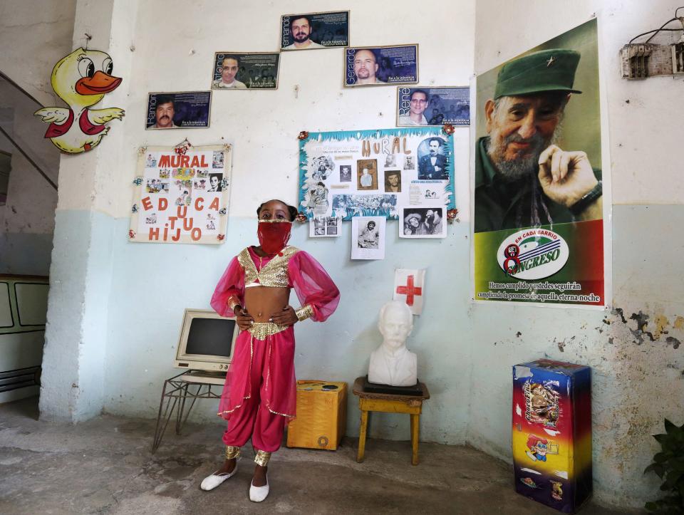 Second grade student at the Enrique Villuendas Primary School, Yinna Gonsalez, poses in her belly dancer costume in Havana
