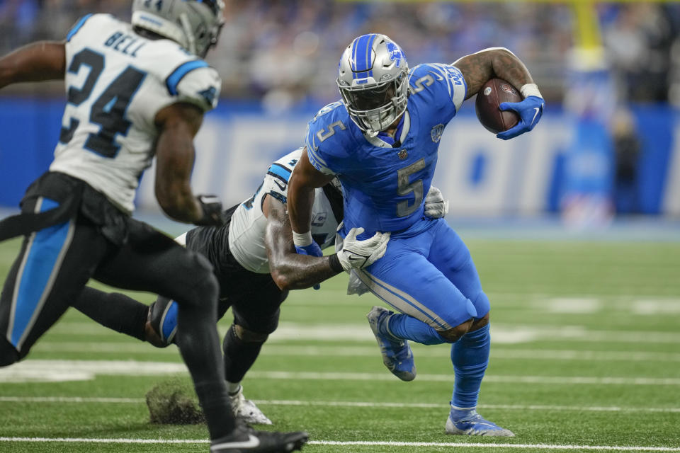 Detroit Lions running back David Montgomery (5) carries as Carolina Panthers linebacker Frankie Luvu (49) tackles in the second half of an NFL football game in Detroit, Sunday, Oct. 8, 2023. (AP Photo/Paul Sancya)