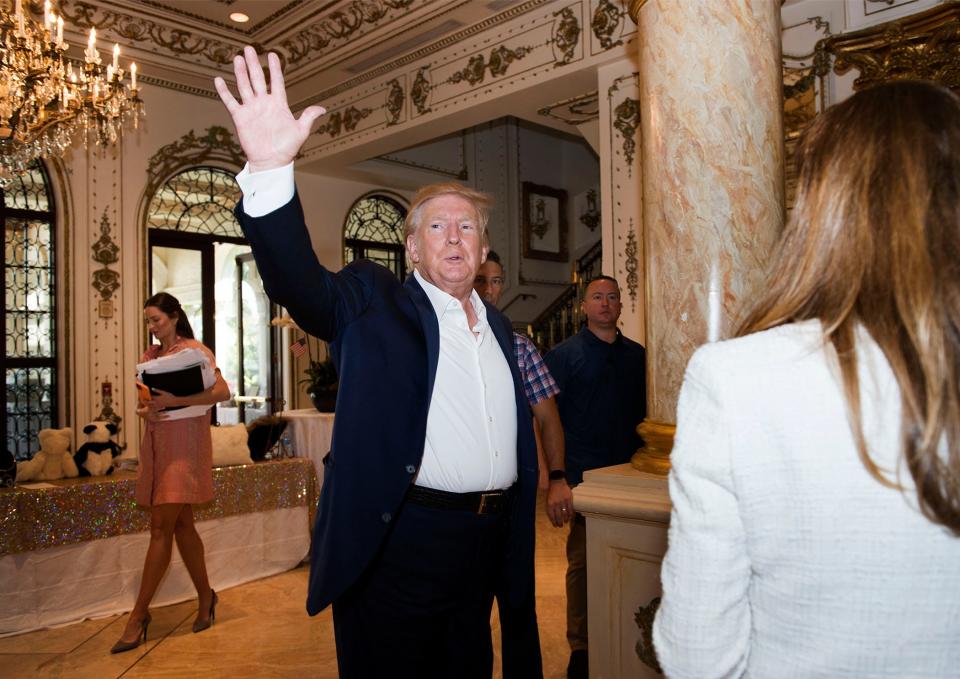 Former United States president Donald Trump drops into the Daughters of the American Revolution Henry Morrison Flagler chapter luncheon at Mar-a-Lago Club in  Palm Beach April 6, 2022.