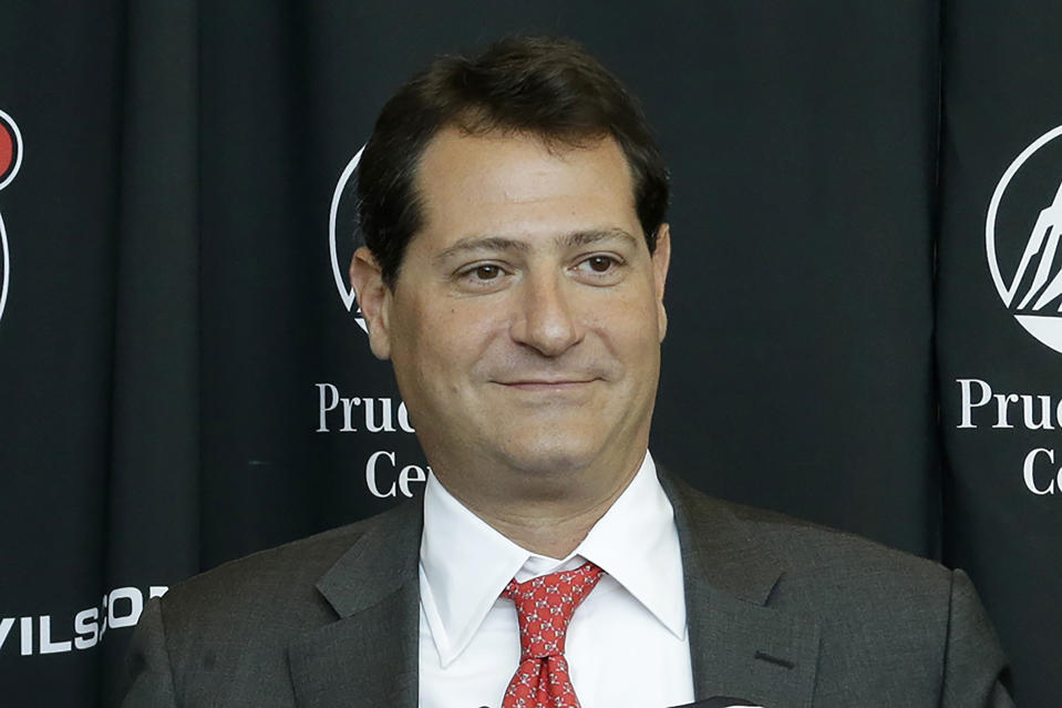 FILE - David Blitzer participates in a New Jersey Devils press conference Thursday, Aug. 15, 2013, in Newark, N.J. Major League Baseball has approved the sale of a minority stake in the Cleveland Guardians to David Blitzer, who also has ownership shares in the NBA's Philadelphia 76ers and the NHL’s New Jersey Devils, two people familiar with the deal told the Associated Press on Thursday, June 16, 2022. (AP Photo/Julio Cortez, File)