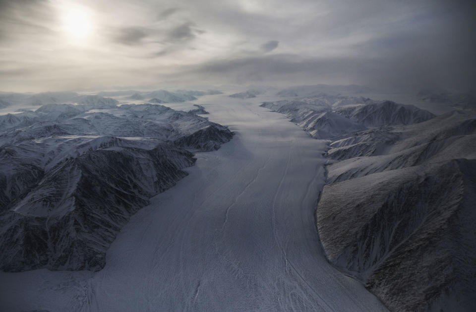 <p>A section of a glacier is seen from NASA’s Operation IceBridge research aircraft on March 29, 2017 above Ellesmere Island, Canada. The ice fields of Ellesmere Island are retreating due to warming temperatures. NASA’s Operation IceBridge has been studying how polar ice has evolved over the past nine years and is currently flying a set of eight-hour research flights over ice sheets and the Arctic Ocean to monitor Arctic ice loss aboard a retrofitted 1966 Lockheed P-3 aircraft. According to NASA scientists and the National Snow and Ice Data Center (NSIDC), sea ice in the Arctic appears to have reached its lowest maximum wintertime extent ever recorded on March 7.Scientists have said the Arctic has been one of the regions hardest hit by climate change. (Mario Tama/Getty Images) </p>