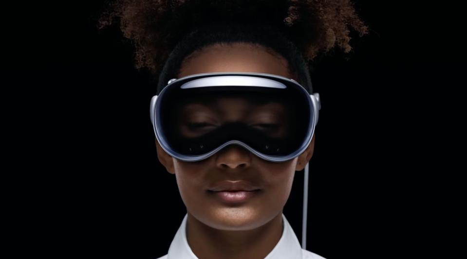 Apple Vision Pro headset on a woman's face.