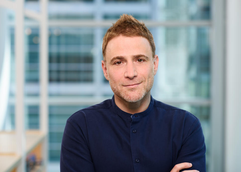 Stewart Butterfield with an out-of-focus window behind him