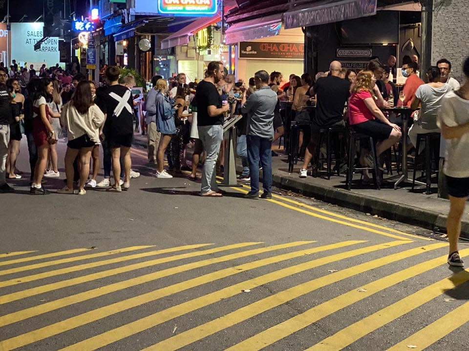 Crowds gather outside Holland Village restaurants on first night of Phase 2 reopening. (PHOTO: SG Covidiots/Facebook)