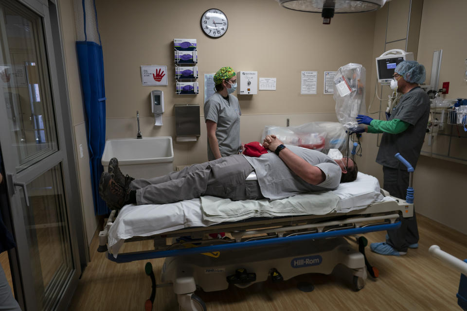 On April 23, medical workers at Kayenta Health Center on the Navajo Nation reservation prepare to practice with a new intubation shield to use when intubating patients. (Photo: ASSOCIATED PRESS)