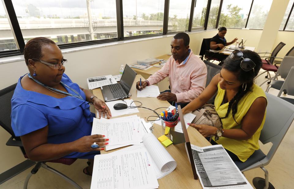 A Certified Application Counselor takes information about Affordable Care Act insurance in Miami