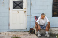 <p>Manager of the Coral Sands Trailer Park, Bruce Ramsey takes a break from cleaning up debris that littered the Florida Keys complex following Hurricane Irma on Sept. 12, 2017 in Key Largo, FL. (Photo: Matt McClain/The Washington Post via Getty Images) </p>