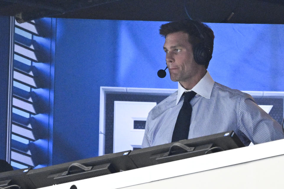 Former NFL quarterback Tom Brady looks on from the broadcast booth during the second half of an NFL football game between the Dallas Cowboys and the New Orleans Saints, Sunday, Sept. 15, 2024, in Arlington, Texas. (AP Photo/Jerome Miron)