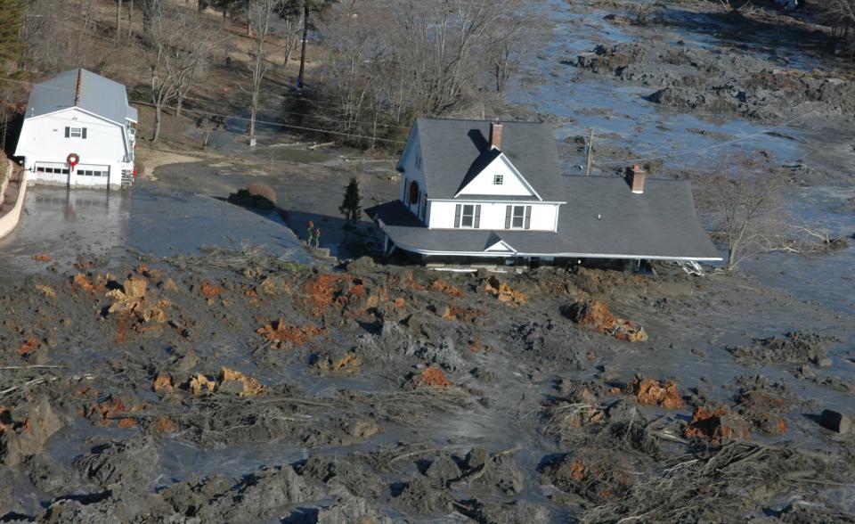 A home near the TVA Kingston Fossil Plant in Roane County is flooded by coal ash in 2008 after the failure of a dike that unleashed more than 1.1 billion gallons of toxic coal ash slurry.