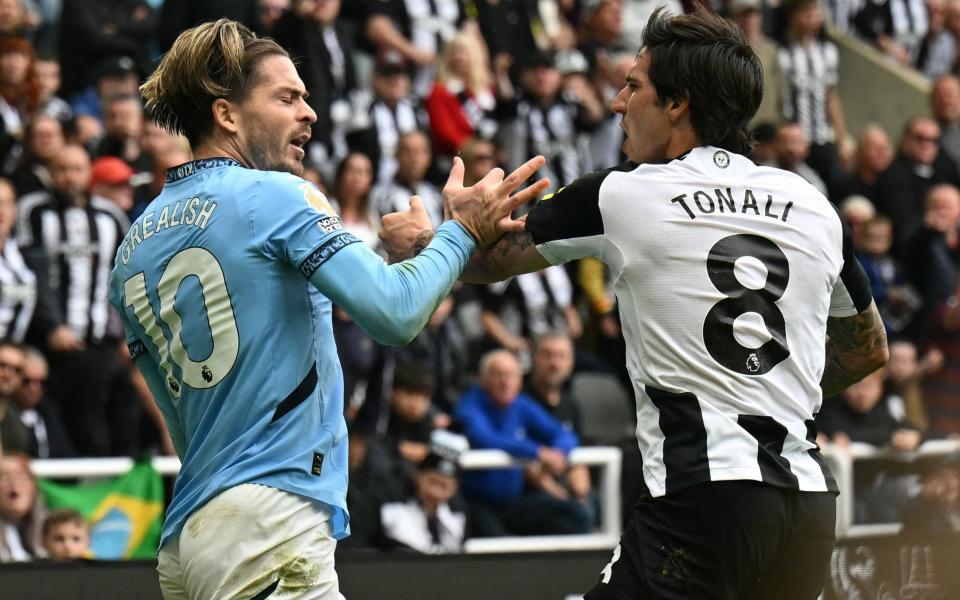 Manchester City's English midfielder #10 Jack Grealish (L) and Newcastle United's Italian midfielder #08 Sandro Tonali (R) are both booked after clashing during the English Premier League football match between Newcastle United and Manchester City