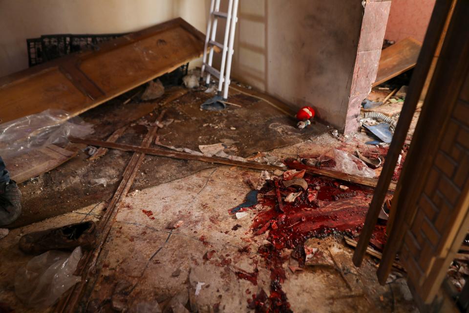 Blood covers the floor of a destroyed house after an operation by the U.S. military in the Syrian village of Atmeh in Idlib province, Syria, Thursday, Feb. 3, 2022 (AP)