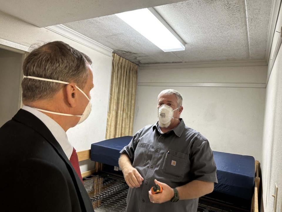 FILE - Bill McGovern, tech engineer with directorate of public works and lead on the mold team Fort Stewart, discusses the mold problem plaguing Fort Stewart single solders living spaces in the barracks with Peter Hoffman, civilian aide to the Secretary of the Army.