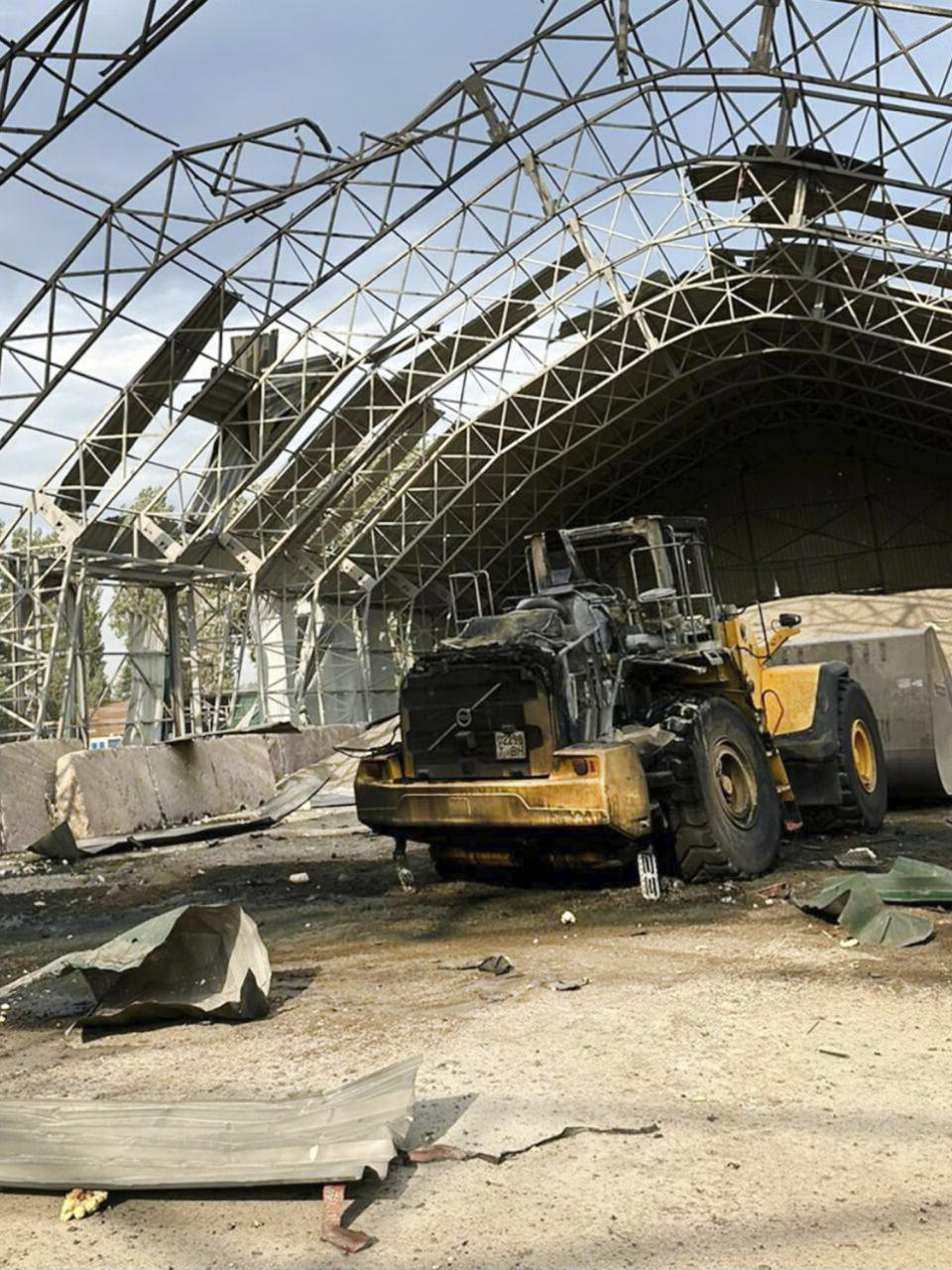 In this photo provided by the Odesa Regional Administration Press Office, a granary destroyed in a Russian drone attack at night is seen in a Danube port near Odesa, Ukraine, early hours Wednesday, Aug. 16, 2023. (Odesa Regional Administration Press Office via AP)