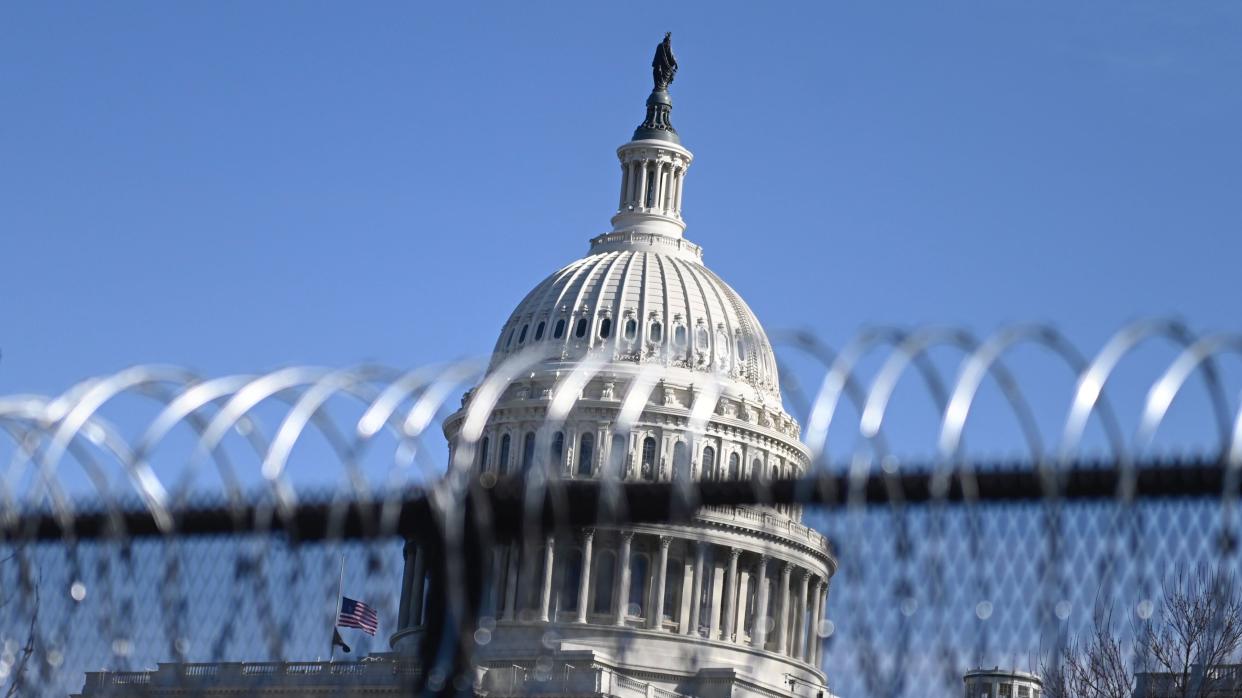 Barbed wire is installed on the top of a security fence surrounding the U.S. Capitol in Washington on Thursday ahead of next week's presidential inauguration of Joe Biden. (Photo: ANDREW CABALLERO-REYNOLDS/AFP via Getty Images)