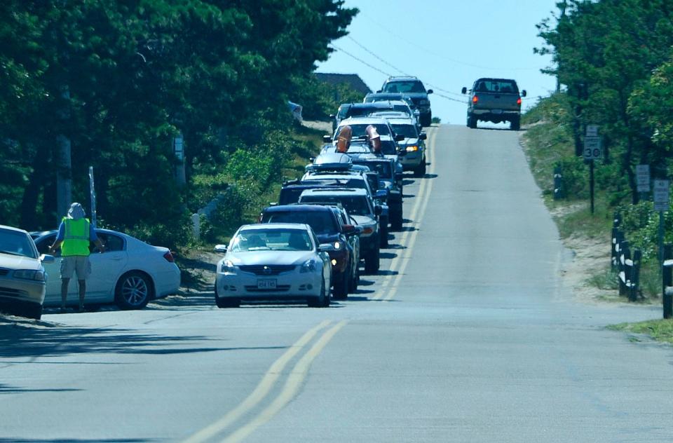 Beach traffic lines up on Ocean View Drive in Wellfleet clogging the road as cars wait their turn at Cahoon Hollow Beach in Wellfleet, in 2016.