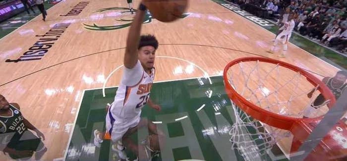 Cam Johnson dunking on Bucks player