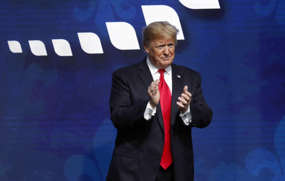 President Donald Trump acknowledges the crowd after speaking at the American Farm Bureau Federation convention in New Orleans, Monday, Jan. 14, 2019. (AP Photo/Gerald Herbert)