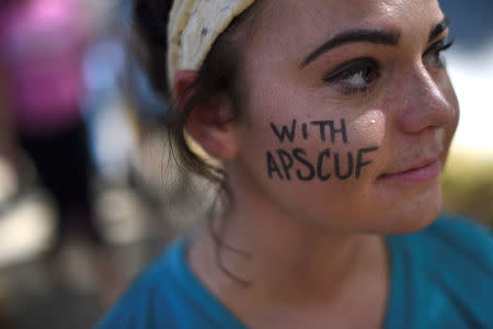 Emma Diluzio, 20, a West Chester University junior, demonstrates with university employees from the APSCUF union representing 5,500 Pennsylvania university and college employees after failing to reach a contract deal with the state education system in West Chester, Pennsylvania, U.S., October 19, 2016. REUTERS/Mark Makela