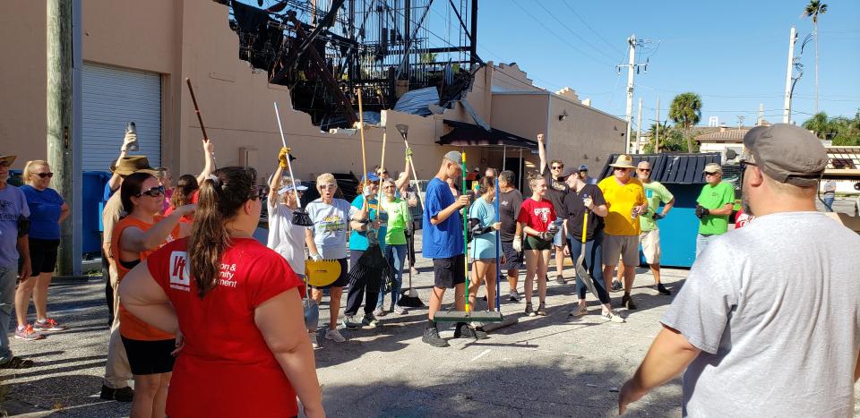 Volunteers and staff gather at Venice Theatre to do cleanup outside the building while engineers and professional cleaning crews work indoors of the building that suffered million of dollars in damage during Hurricane Ian.