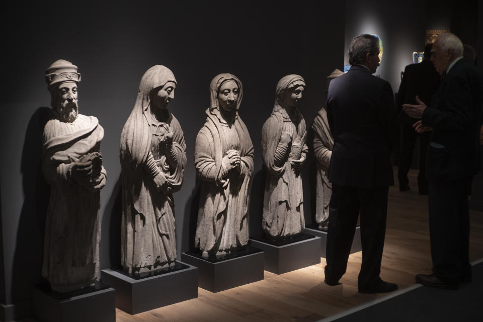 Sandstone statues of Mourners at the Holy Sepulchre, by the Masters of Chimay, Mons, Belgium (1540-1580), are shown at a gallery at the European Fine Art Foundation, known by its acronym TEFAF, in Maastricht, southern Netherlands, Thursday, March 7, 2024. (AP Photo/Peter Dejong)