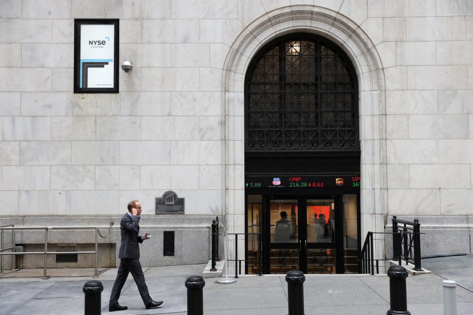 A person enters the New York Stock Exchange (NYSE) in Manhattan, New York City, U.S., May 19, 2022. REUTERS/Andrew Kelly