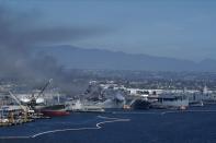 Smoke rises from a fire on board the U.S. Navy amphibious assault ship USS Bonhomme Richard