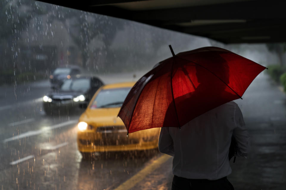 Rain falls during the morning commute in Singapore, Thursday, July 20, 2023. With no natural water resources, the country has relied on importing water from neighboring Malaysia via a series of deals allowing inexpensive purchase of water drawn from the country's Johor River. But the deal is set to expire in 2061 with uncertainty over its renewal. And climate change, bringing increased intense weather, rising seas and an increase in average temperatures, is expected to exacerbate water insecurity, according to research done by the Singaporean government. (AP Photo/David Goldman)