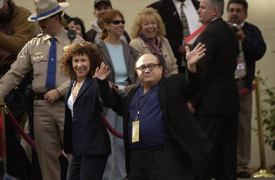 Actors Danny DeVito and wife Rhea Perlman leave the Sutter Club after attending a luncheon given for Arnold Schwarzenegger after he was sworn in as the 38th governor of California on Nov. 17, 2003 in Sacramento. DeVito starred with Schwarzenegger in “Twins.”