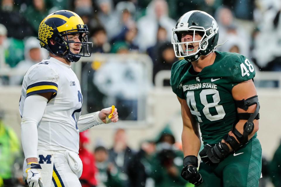 Michigan State defensive end Kenny Willekes celebrates a play against Michigan quarterback Shea Patterson during the second half at Spartan Stadium in East Lansing, Saturday, Oct. 20, 2018.