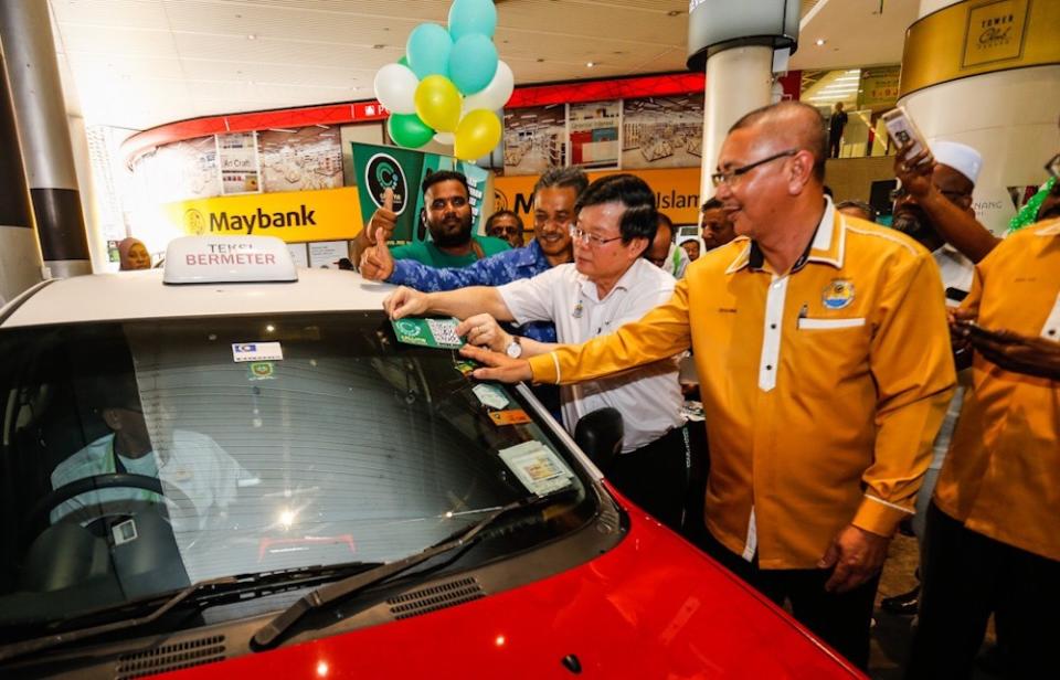 Penang Chief Minister Chow Kon Yeow officiates the launch of the Callme Cab app in George Town May 22, 2019.