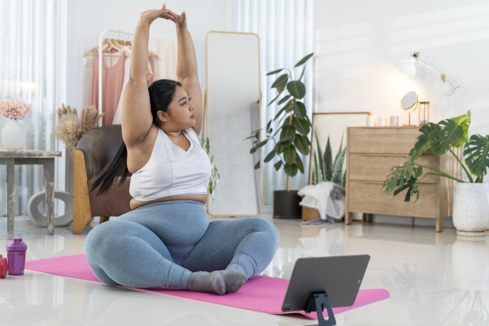 woman doing yoga at home