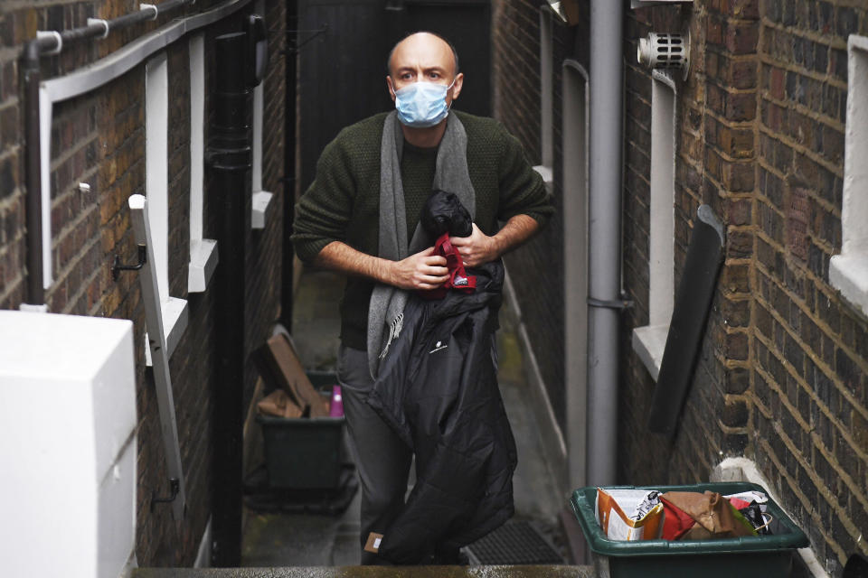 FILE - In this Nov. 14, 2020 file photo former parliament advisor Dominic Cummings walks, outside his north London home after he resigned from his role, in London. People were outraged when Cummings, the chief architect of England's lockdown rules drove from London to his father's seaside home after both he and his wife tested positive for the virus, violating the country's travel rules. He lost his job and is now being investigated by police. (Kirsty O'Connor/PA via AP,File)