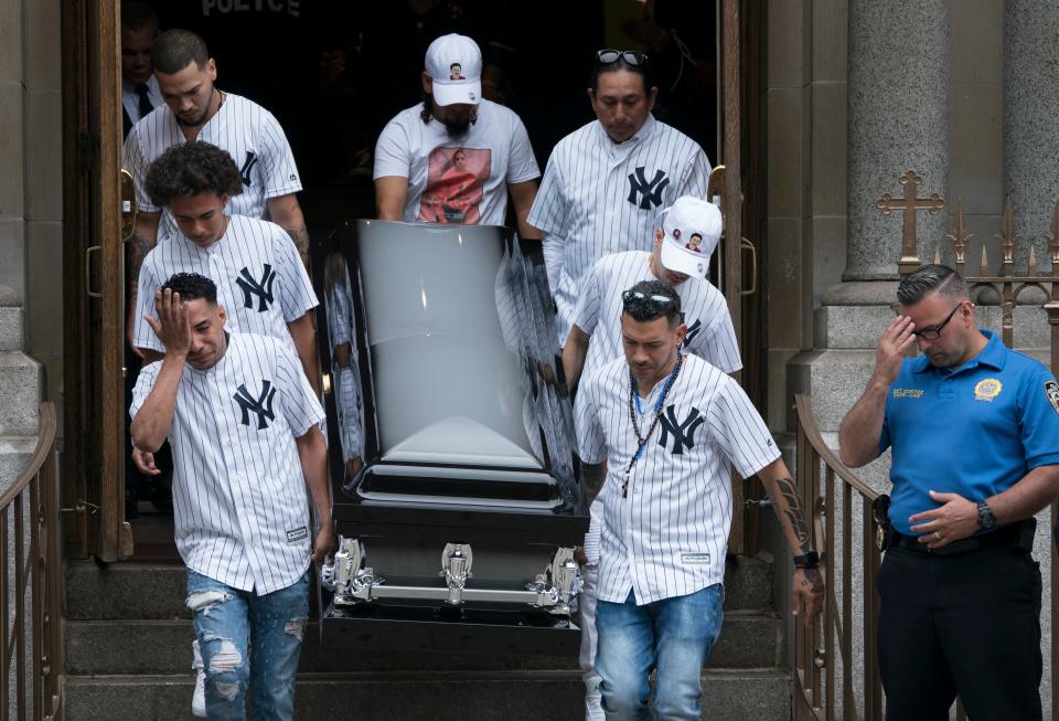 Pallbearers wearing New York Yankee jerseys carry the body&nbsp;of Guzman-Feliz&nbsp;following his funeral service on June 27, 2018. (Photo: DON EMMERT via Getty Images)