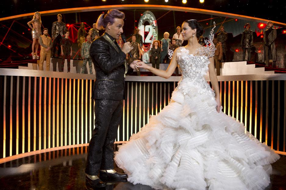This image released by Lionsgate shows Stanley Tucci as Caesar Flickerman, left, and Jennifer Lawrence as Katniss Everdeen in a scene from "The Hunger Games: Catching Fire." The film releases Nov. 22, 2013. (AP Photo/Lionsgate, Murray Close)