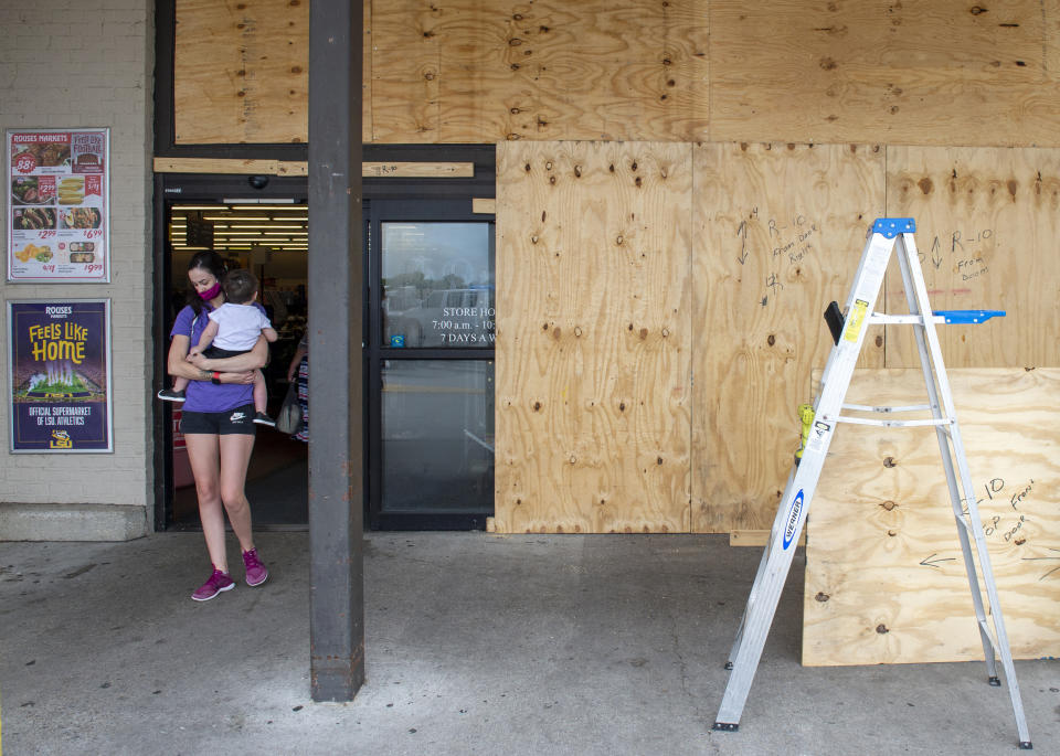 The Rouses grocery in Morgan City, La., is boarded up as residents prepare for the arrival of Hurricane Ida on Saturday, Aug. 28, 2021. The storm is expected to bring winds as high as 140 mph when it slams ashore late Sunday (Chris Granger/The Times-Picayune/The New Orleans Advocate via AP)