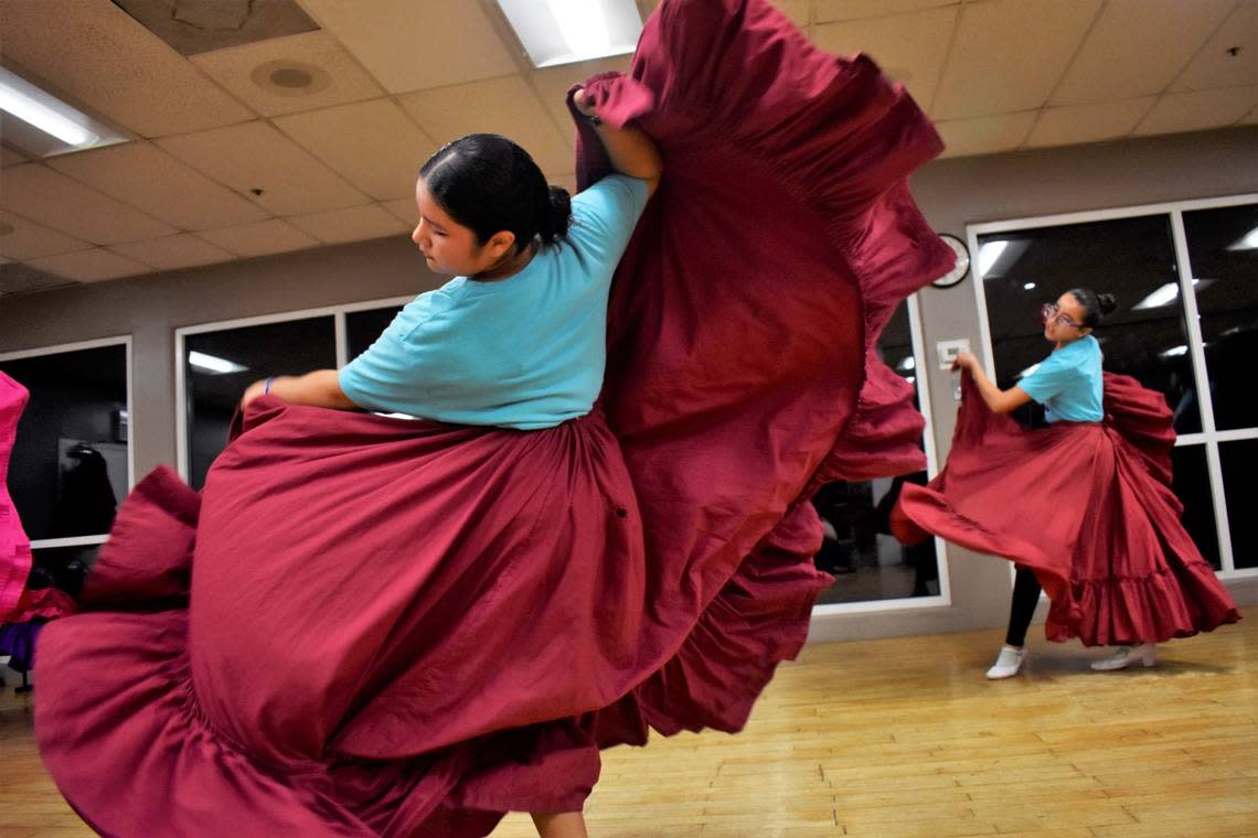 Leylie Garduno (17, center) swooshed her skirt during the Grupo Folklórico Tangu Yuu dance rehearsal on Sept. 13, 2022.