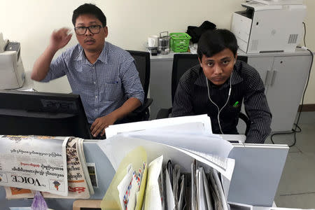 FILE PHOTO: Reuters journalists Wa Lone (L) and Kyaw Soe Oo, who are based in Myanmar, pose for a picture at the Reuters office in Yangon, Myanmar December 11, 2017. REUTERS/Antoni Slodkowski/File Photo