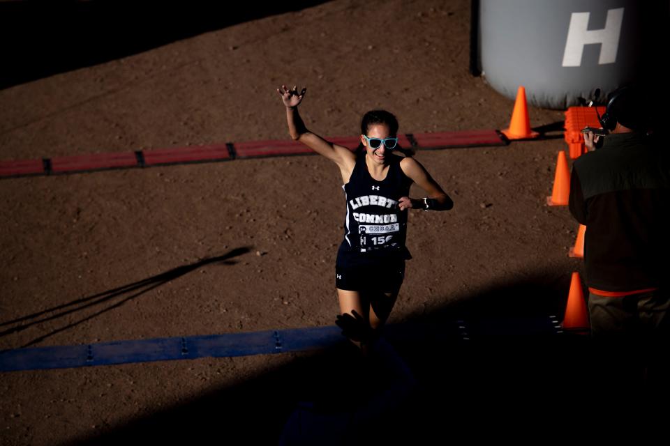 Liberty Common High School's Isabel Allori crosses the finish line with the time of 17:10.3 to win the girls Class 3A cross country championships at the Norris Penrose Event Center in Colorado Springs, Colo. on Saturday, Oct. 29, 2022.