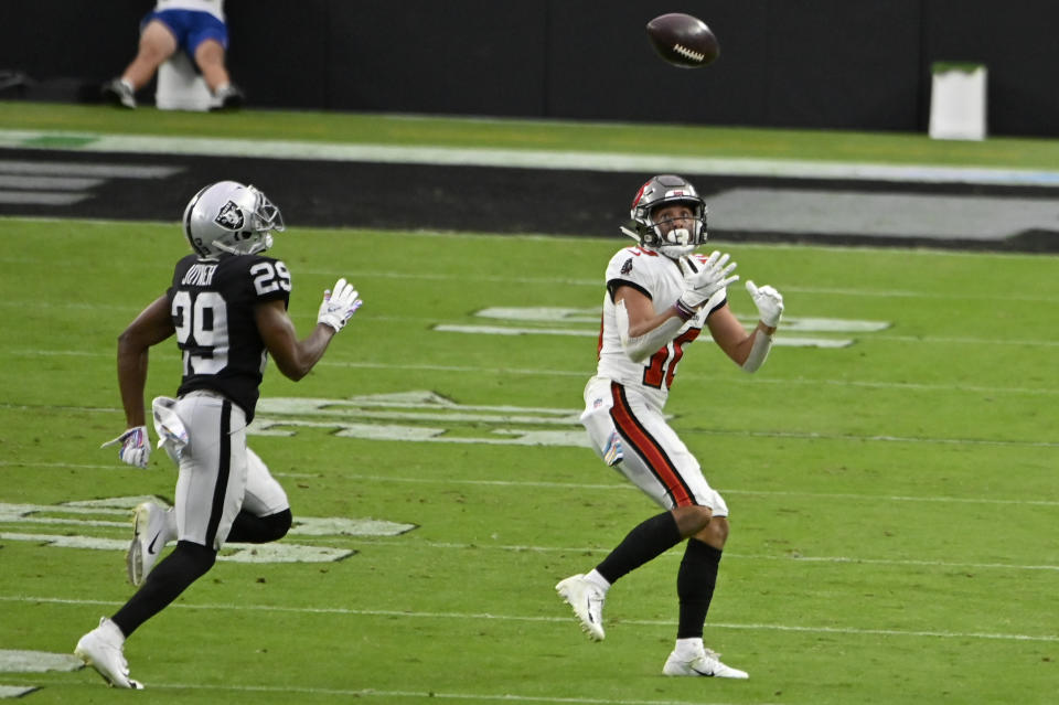 Tampa Bay Buccaneers wide receiver Scott Miller (10) makes a catch over Las Vegas Raiders free safety Lamarcus Joyner (29) during the second half of an NFL football game, Sunday, Oct. 25, 2020, in Las Vegas. (AP Photo/David Becker)