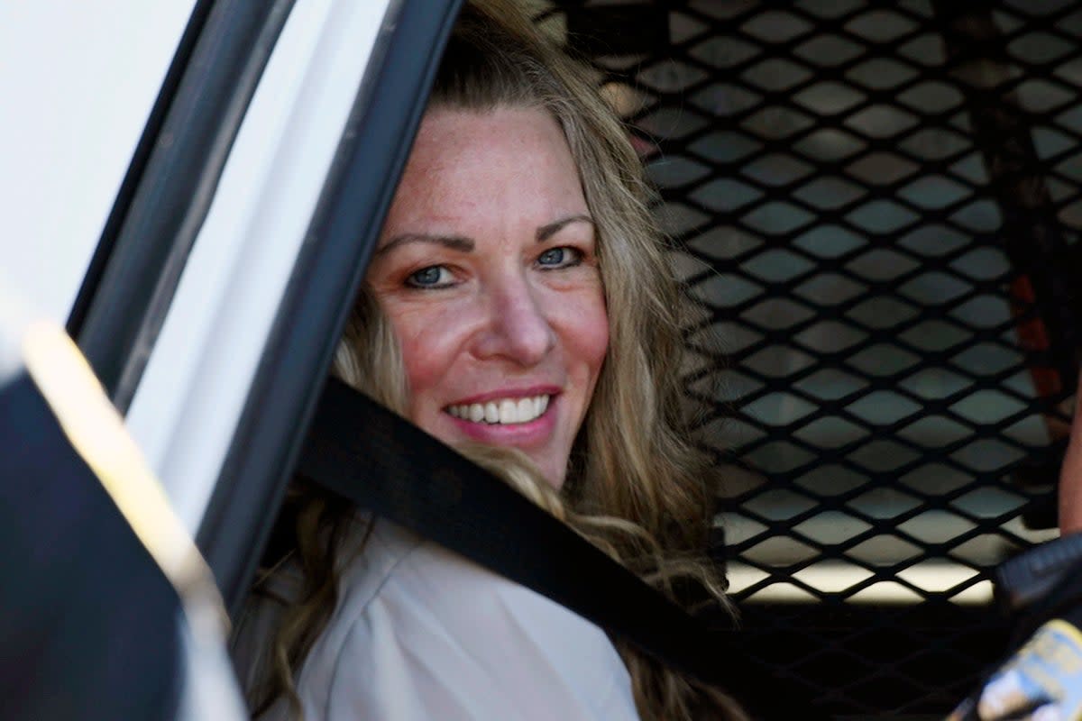 Lori Vallow smiles as she is taken to a court appearance in 2022 (AP)