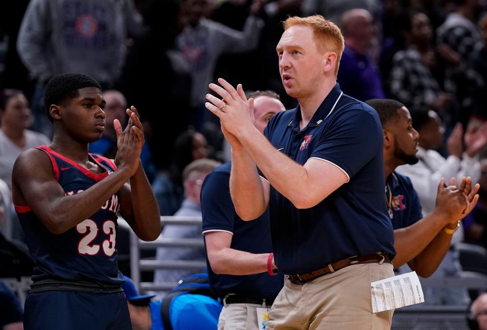 Kokomo Wildkats head coach John Peckinpaugh walks along the sidelines on Saturday, March 25, 2023 at Gainbridge Fieldhouse in Indianapolis. The Ben Davis Giants defeated the Kokomo Wildkats, 53-41, for the IHSAA Class 4A state finals championship. 