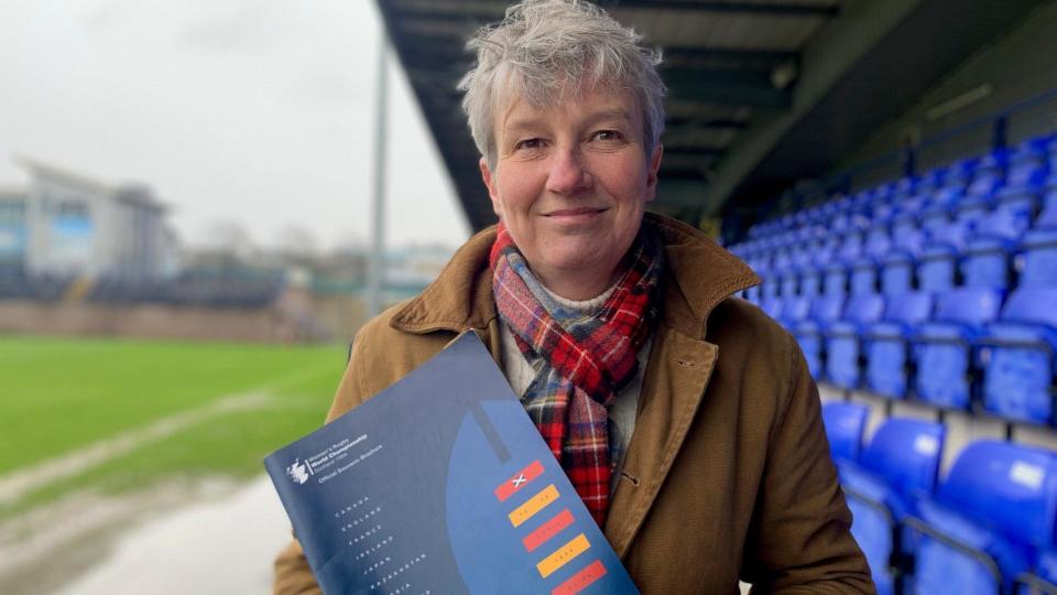 Sue Brodie with her World Cup programme from 1994