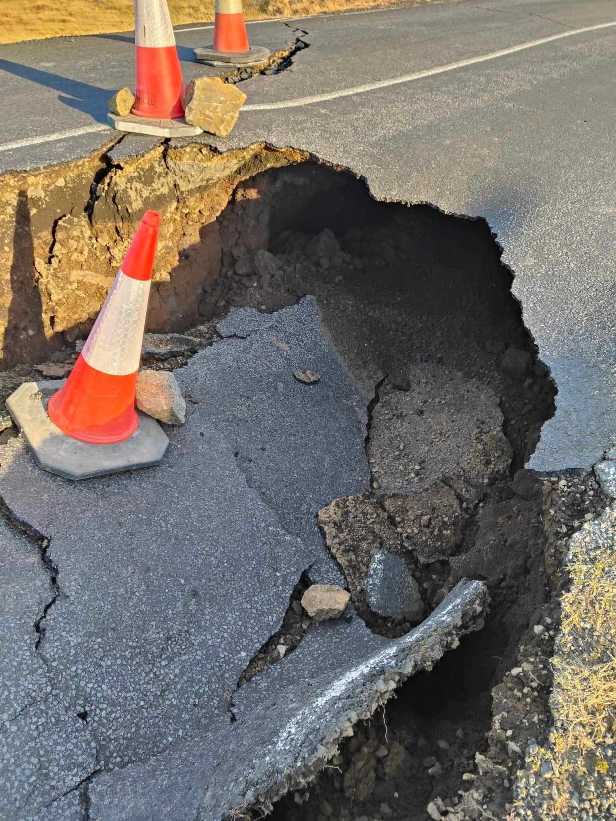 A view of cracks, emerged on a road due to volcanic activity, near Grindavik, Iceland on 13 November 2023 (Reuters)