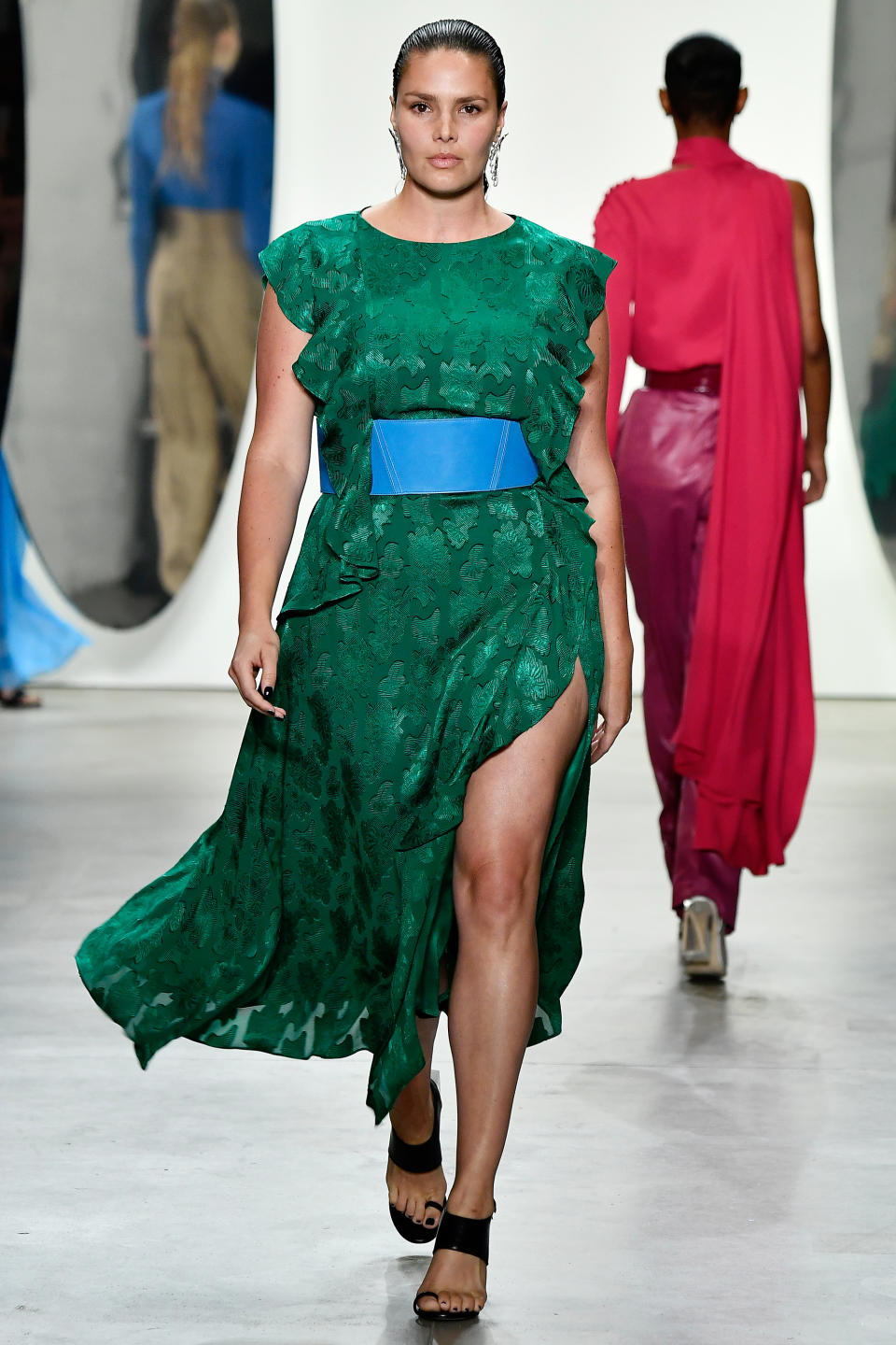 <p>Huffine stunned in an emerald green number with a dramatic slit at Prabal Gurung.</p>