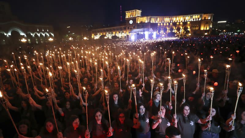 Torchlight procession march during a demonstration to mark the 107th anniversary of the massacre and honor the victims of the Armenian genocide, in Yerevan, Armenia, Saturday, April 23, 2022. Armenians marked the anniversary of the death of up to 1.5 million Armenians by Ottoman Turks, an event widely viewed by scholars as genocide, though Turkey refutes the claim.