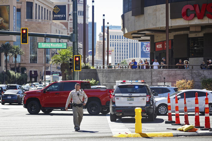 Police work at the scene where multiple people were stabbed in front of a Strip casino in Las Vegas, Thursday, Oct. 6, 2022. (Rachel Aston/Las Vegas Review-Journal via AP)
