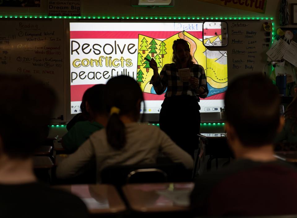 Sarah Simons, a Grand Ledge Public Schools counselor, speaks with fourth-graders at Willow Ridge Elementary, Wednesday, Jan. 10, 2024, on ways to resolve conflict through communication. There is a shortage of school counselors in the Greater Lansing area.