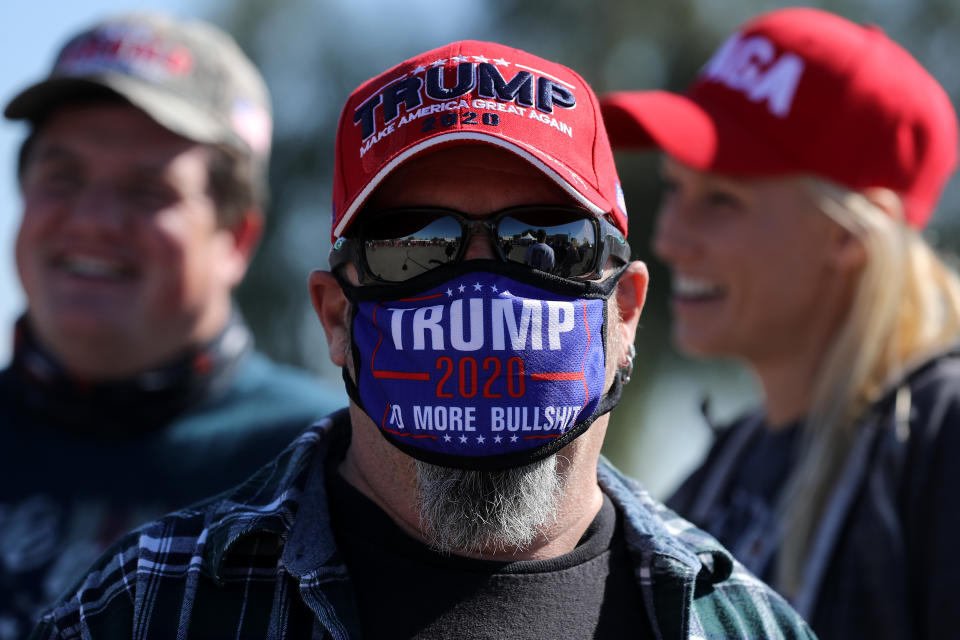 GOODYEAR, ARIZONA - OCTOBER 28: A supporter of U.S. President Donald Trump waits in line to attend a campaign rally with Trump at Phoenix Goodyear Airport October 28, 2020 in Goodyear, Arizona. With less than a week until Election Day, Trump and his opponent, Democratic presidential nominee Joe Biden, are campaigning across the country. (Photo by Chip Somodevilla/Getty Images)