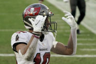 Tampa Bay Buccaneers' Scott Miller reacts after catching a 39-yard touchdown pass against Green Bay Packers' Kevin King during the first half of the NFC championship NFL football game in Green Bay, Wis., Sunday, Jan. 24, 2021. (AP Photo/Morry Gash)